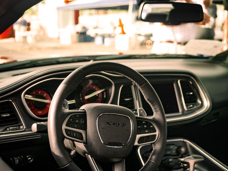 Close-up of a luxury car's steering wheel and dashboard