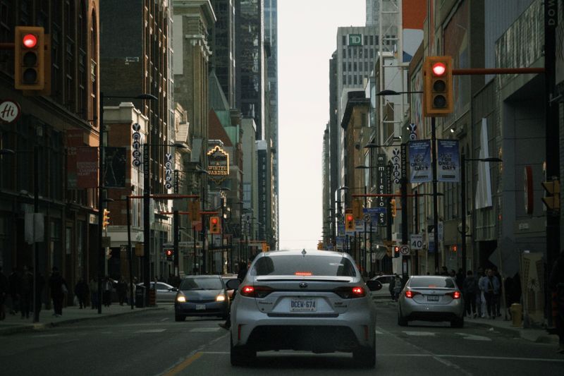 A busy downtown street with city traffic