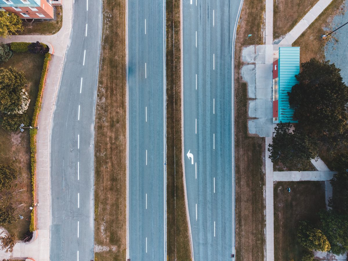 Bird's eye view of an empty urban two-lane highway